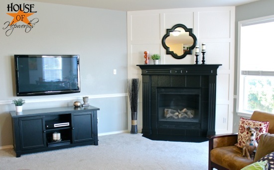 A dramatic fireplace makeover white moulding black mantel