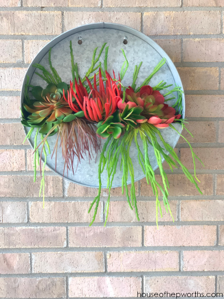 metal round wall planter with faux succulents